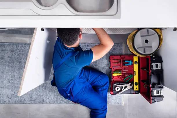 Technician repairing commercial kitchen equipment