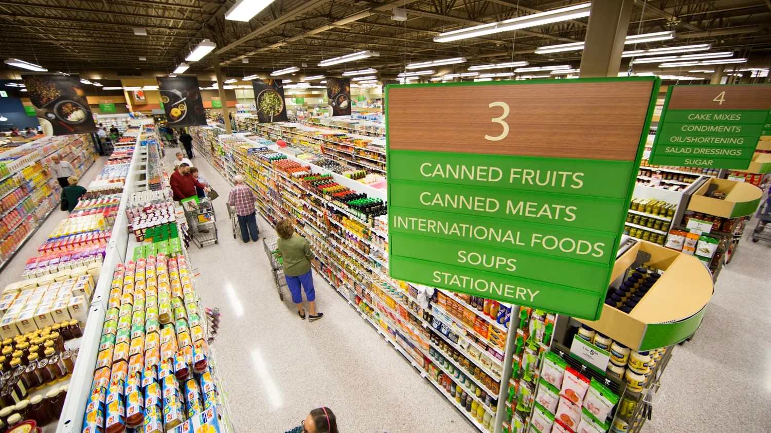 Grocery aisle with canned foods and dry goods representing HACCP food safety standards at licensed commissary kitchen in Tampa – Tampa Caterers